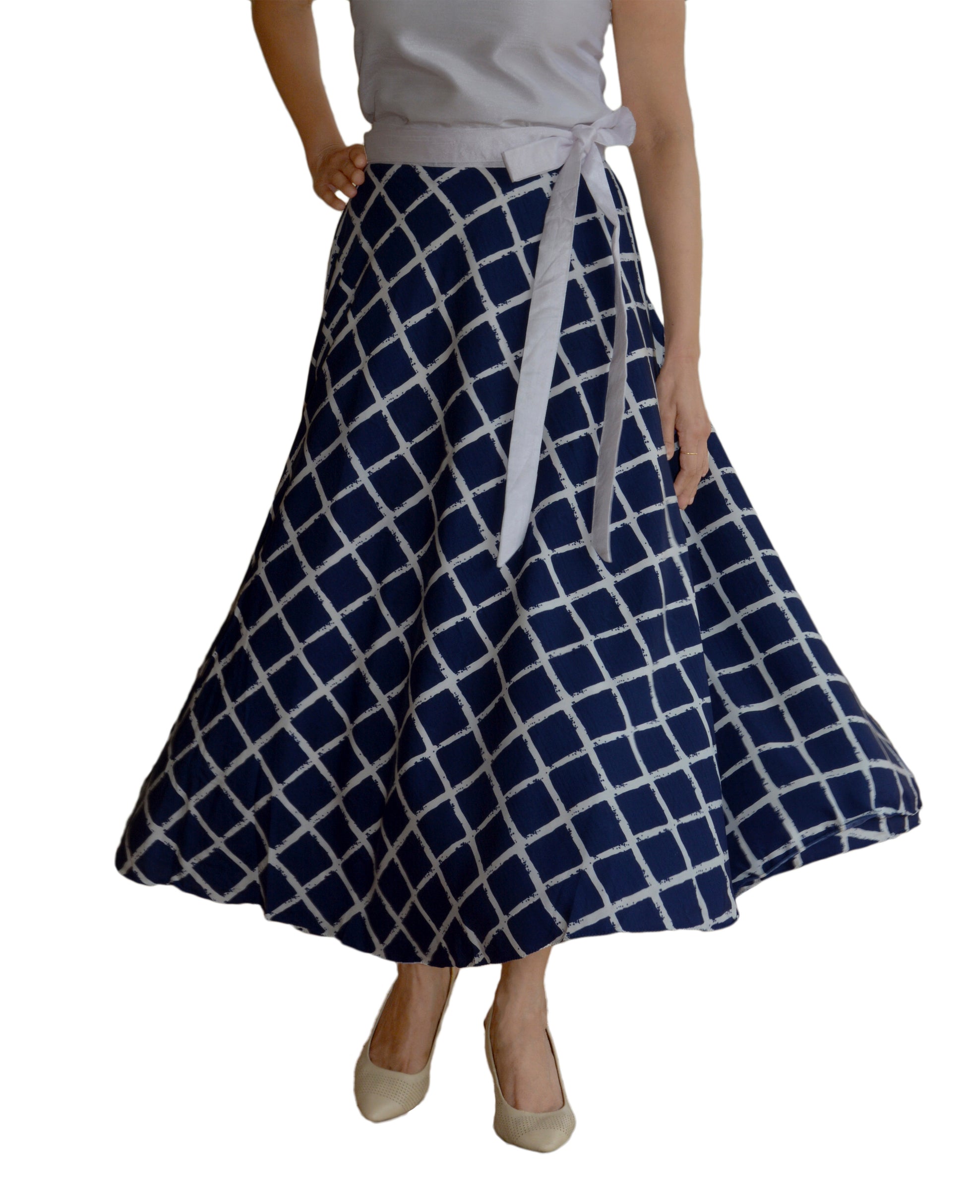 Woman wearing a blue and white checkered free size crepe wrap skirt on a white background WA000125