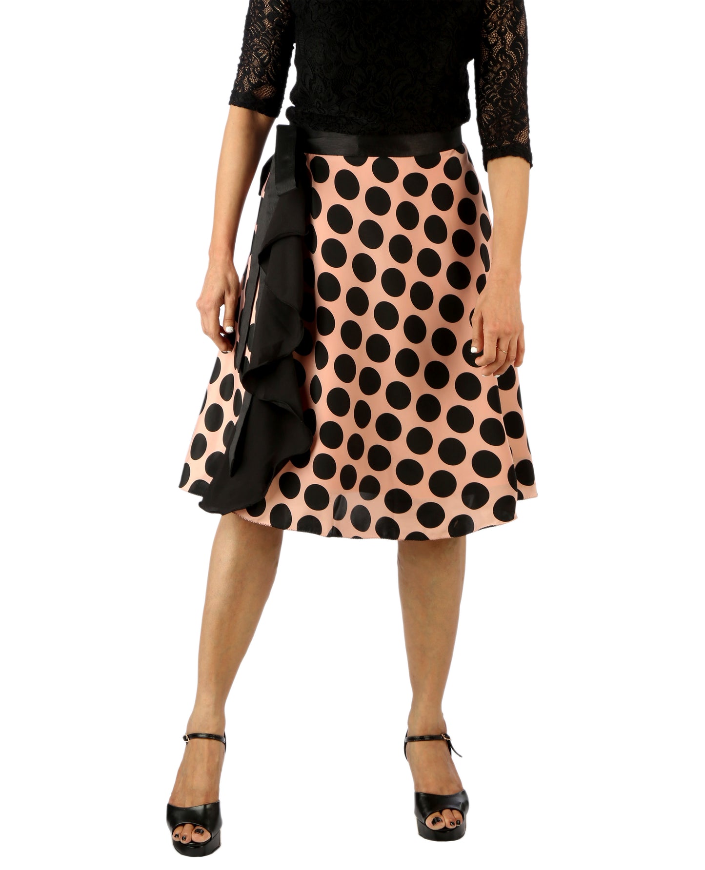 Woman wearing a polka dot ruffle free size wrap skirt with a plain background WA000181
