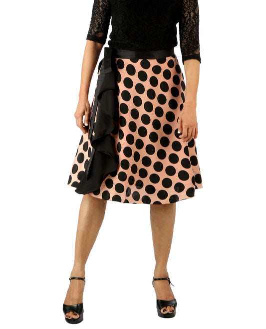 Woman wearing a polka dot ruffle free size wrap skirt with a plain background WA000181
