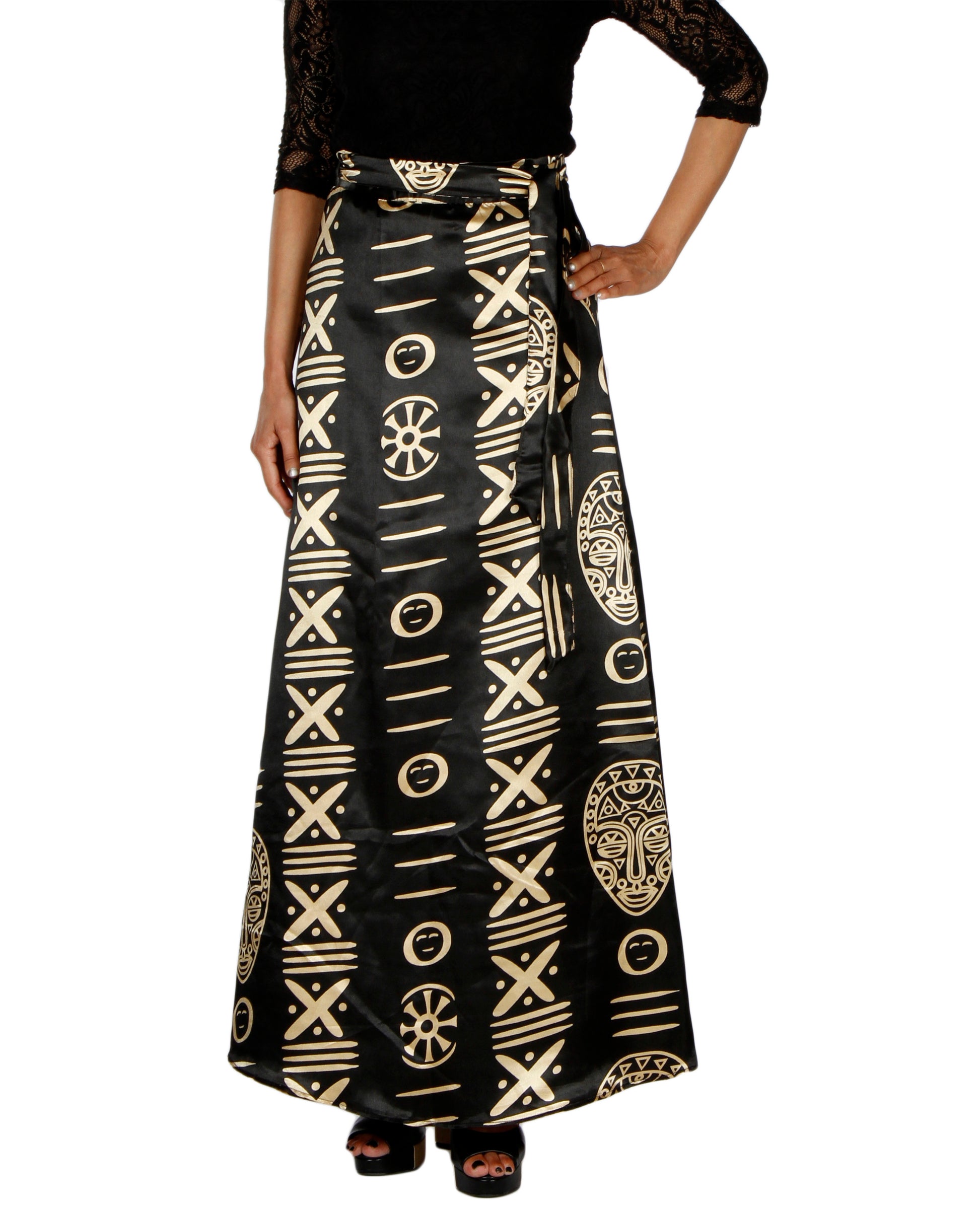Black A-line free size wrap skirt with gold tribal patterns worn by a person on a white background WA000201