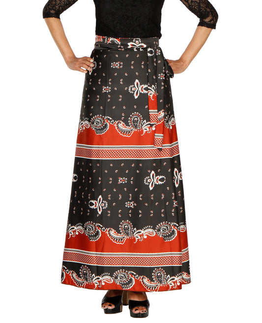 Long A-line black and red printed free size wrap skirt worn by a person on a white background WA000202