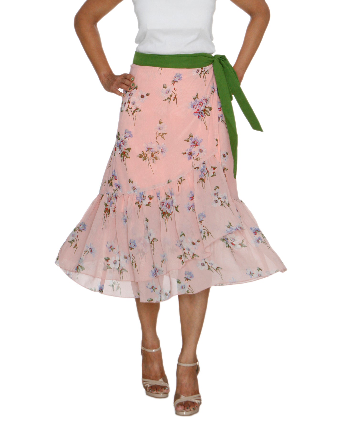 Woman wearing a peach floral free size wrap skirt with green ribbon and white top on a white background WA000211