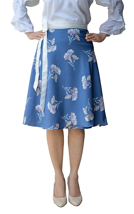 Woman wearing a blue floral crepe free size wrap skirt with a white blouse on a white background WA000092